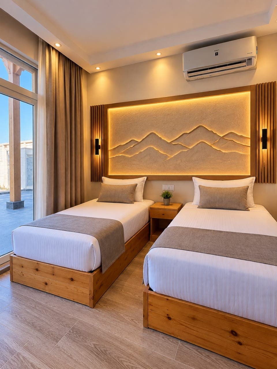 Twin room with Sinai-inspired mountain relief artwork